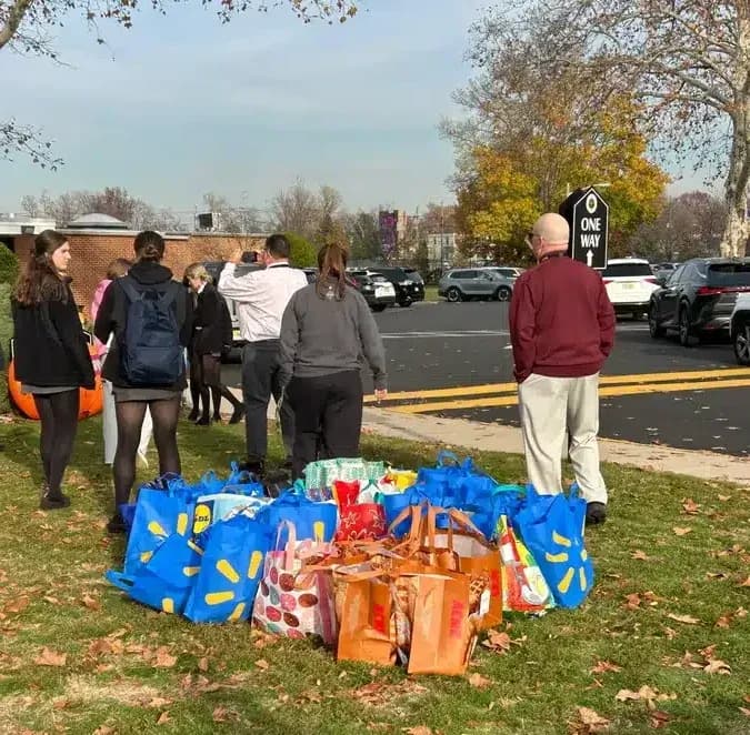 People waiting for thanksgiving food drive for Bishop Eustace